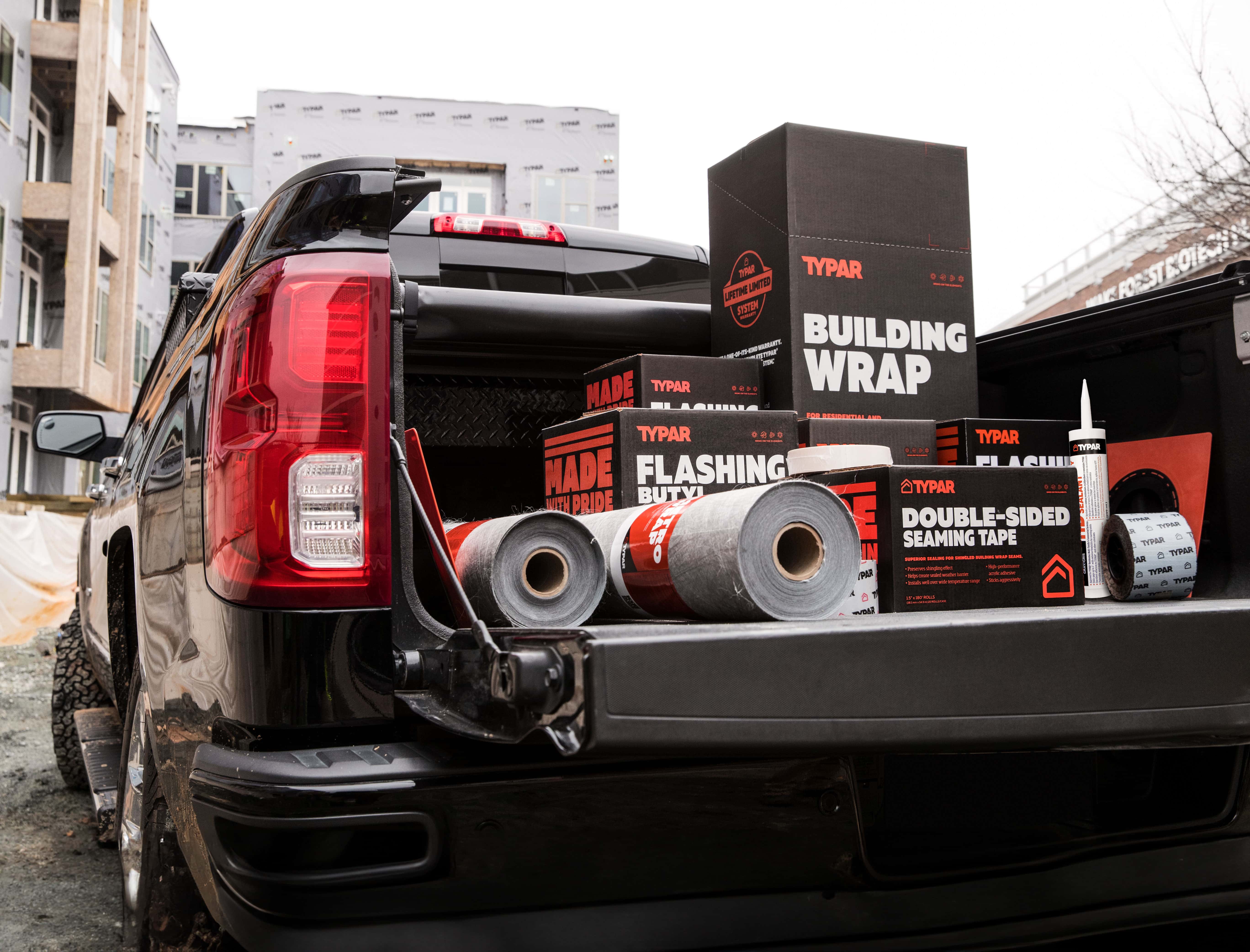Typar range of products in packaging in the back of a pickup truck.
